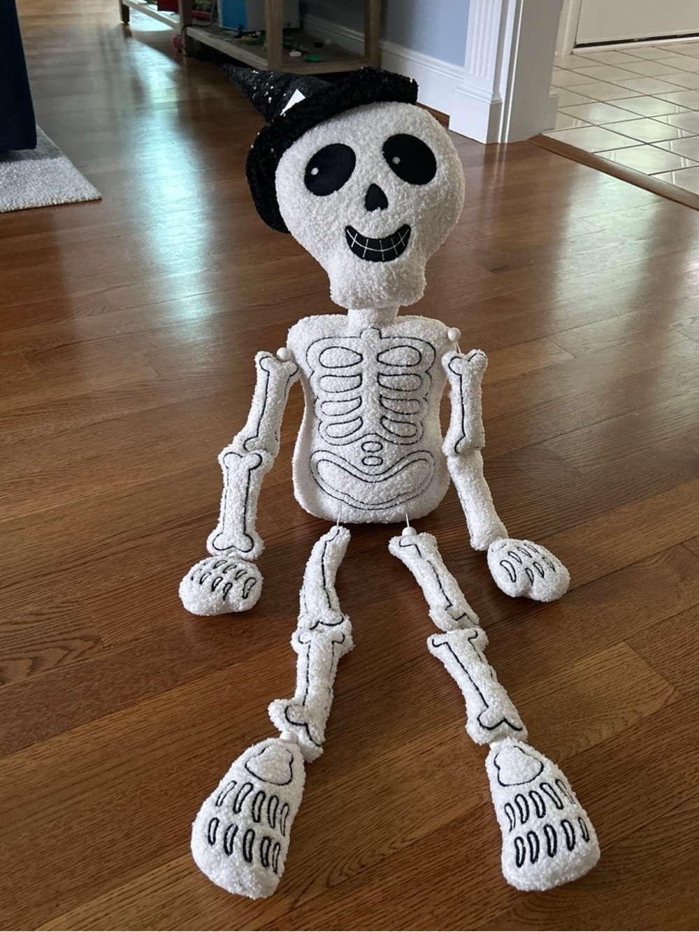 Plush sitting skeleton decor